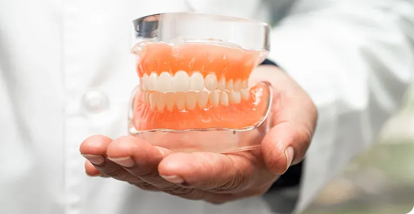 Happy patient pointing to smile