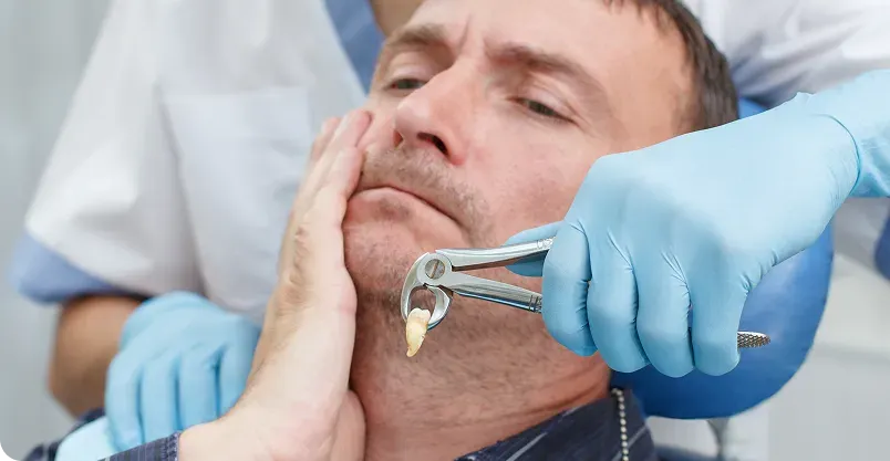 Happy patient pointing to smile